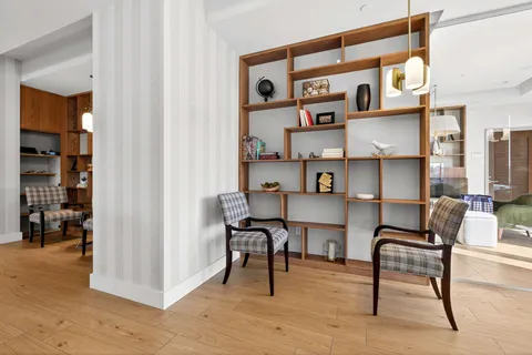 a view of a livingroom with furniture and windows
