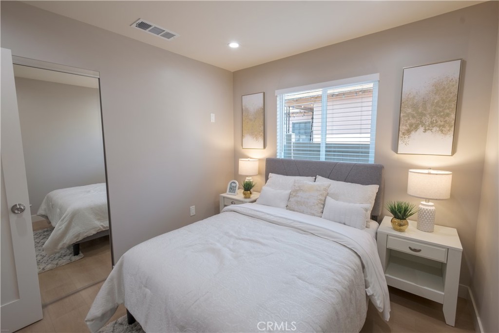 223 South Aprilia Avenue Compton, CA 90220 - Photo 16 of 46 a bedroom with a bed and a window