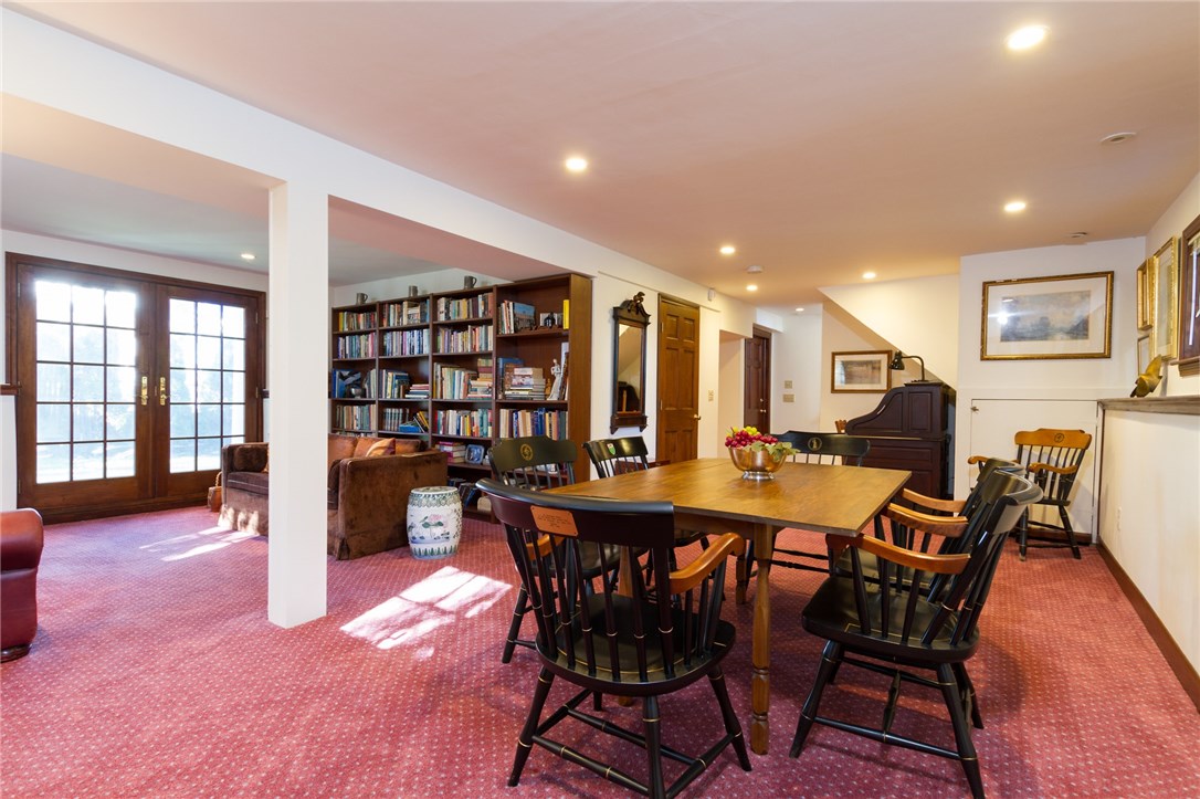 191 Old Beach Road Newport, RI 02840 - Photo 29 of 41 Lower level Family room or office- with a full bath and second laundry area. Access to lawn and internal to garage.