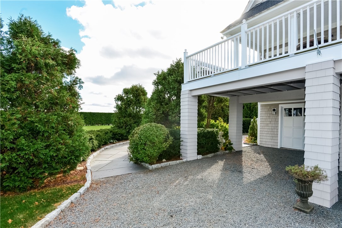 191 Old Beach Road Newport, RI 02840 - Photo 31 of 41 Blue stone pathway to patio and front entrance. 2 Garage bays under portico.