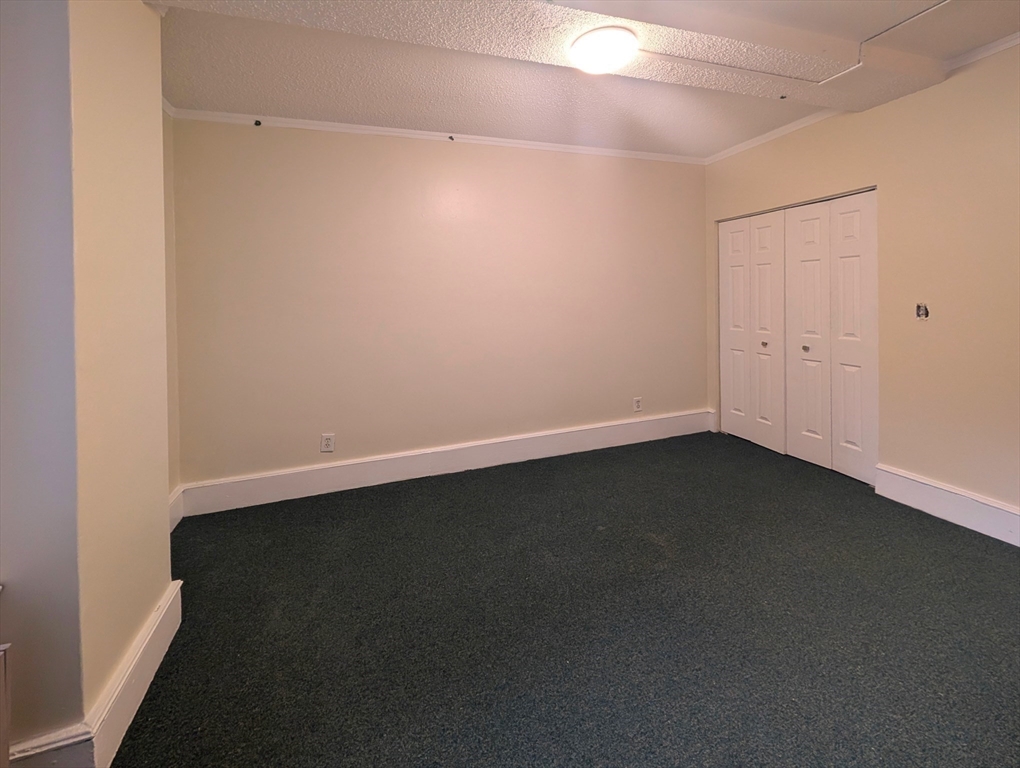 140 Chestnut Street, Unit 207 Springfield, MA 01103 - Photo 7 of 13 an empty room with a empty space and a window