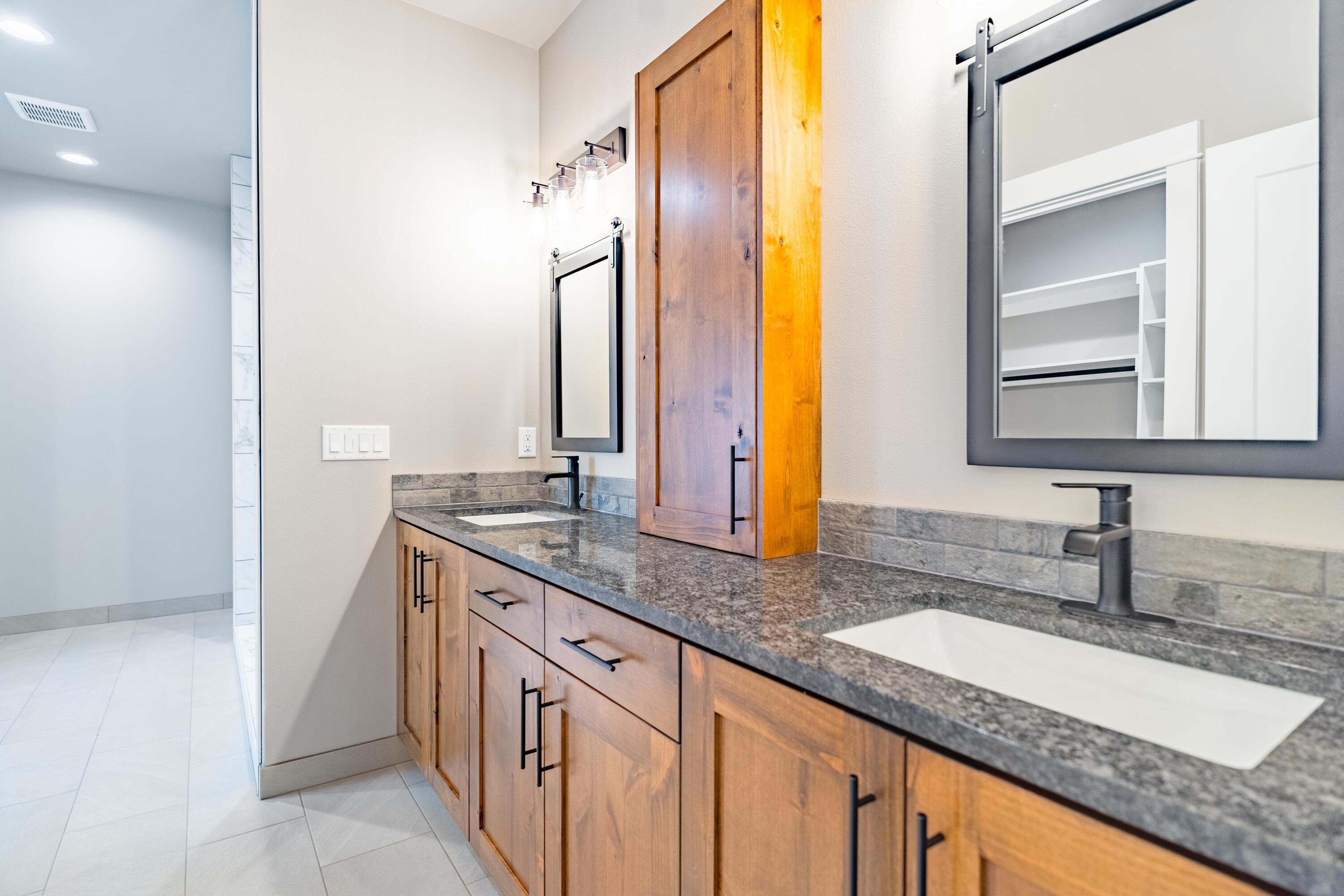 16099 Dyke Road La Pine, OR 97739 - Photo 22 of 37 Primary Bathroom with Double Vanities and Storage Cabinet