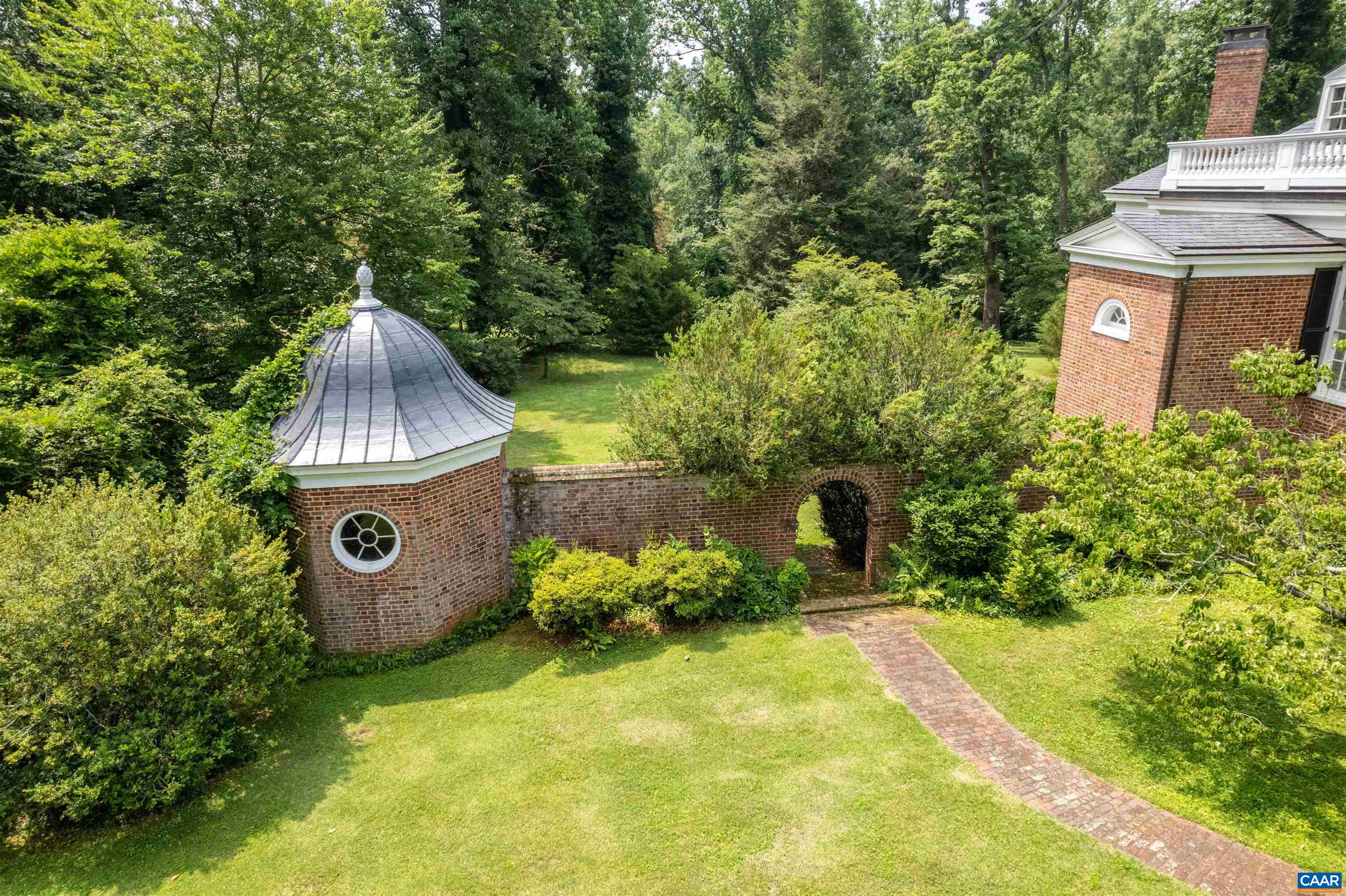 1715 Lake Road Charlottesville, VA 22901 - Photo 4 of 15 a view of a garden with a tree