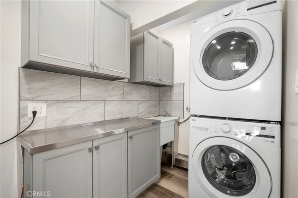 a living room with a white couch and a window