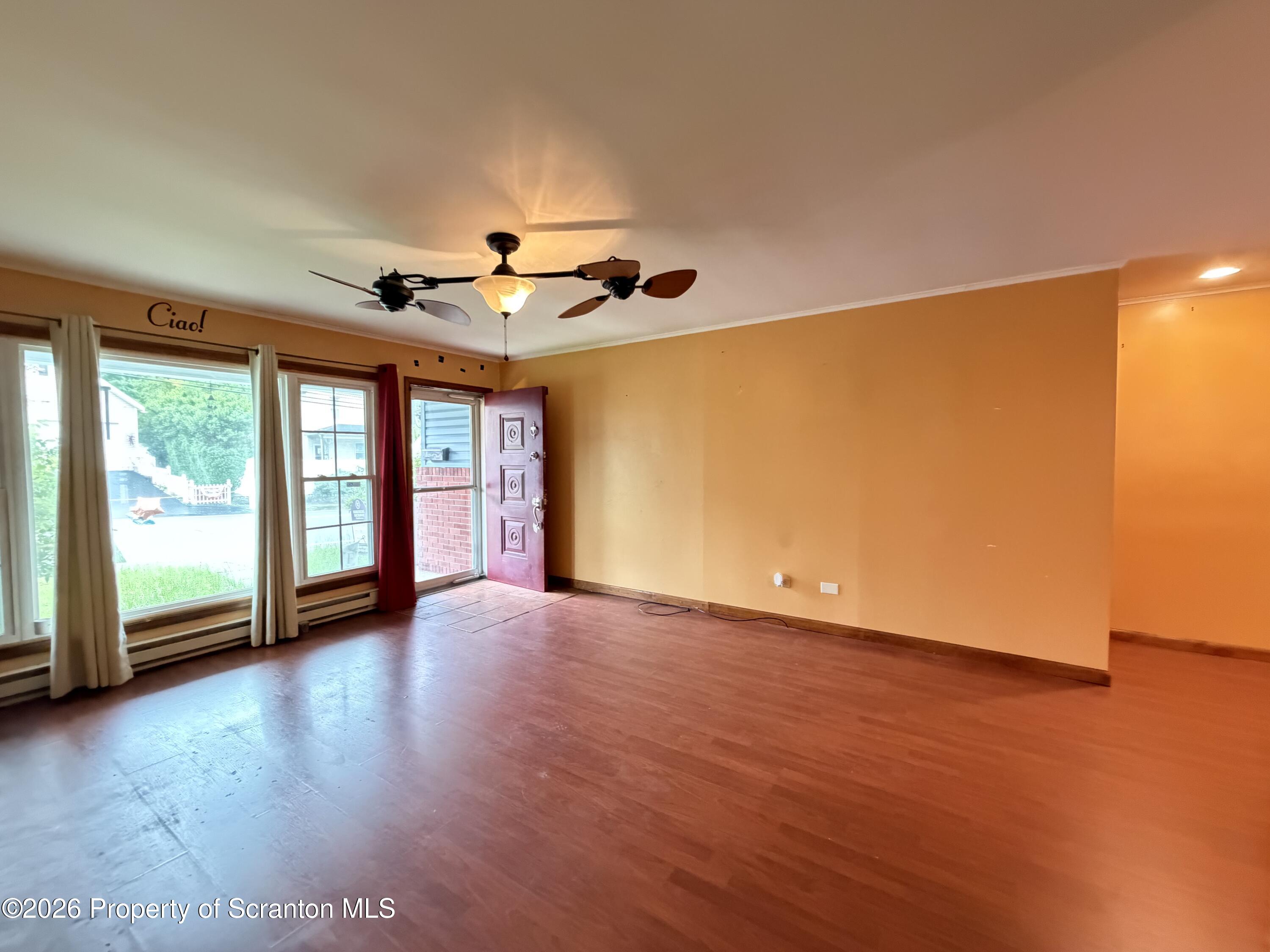 1019 Moosic Street Scranton, PA 18505 - Photo 32 of 43 a view of an empty room with a window and wooden floor