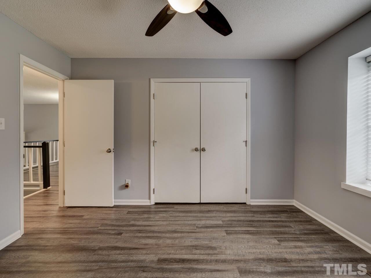 5857 Branchwood Road Raleigh, NC 27609 - Photo 25 of 42 a view of room with hardwood floor and cabinet