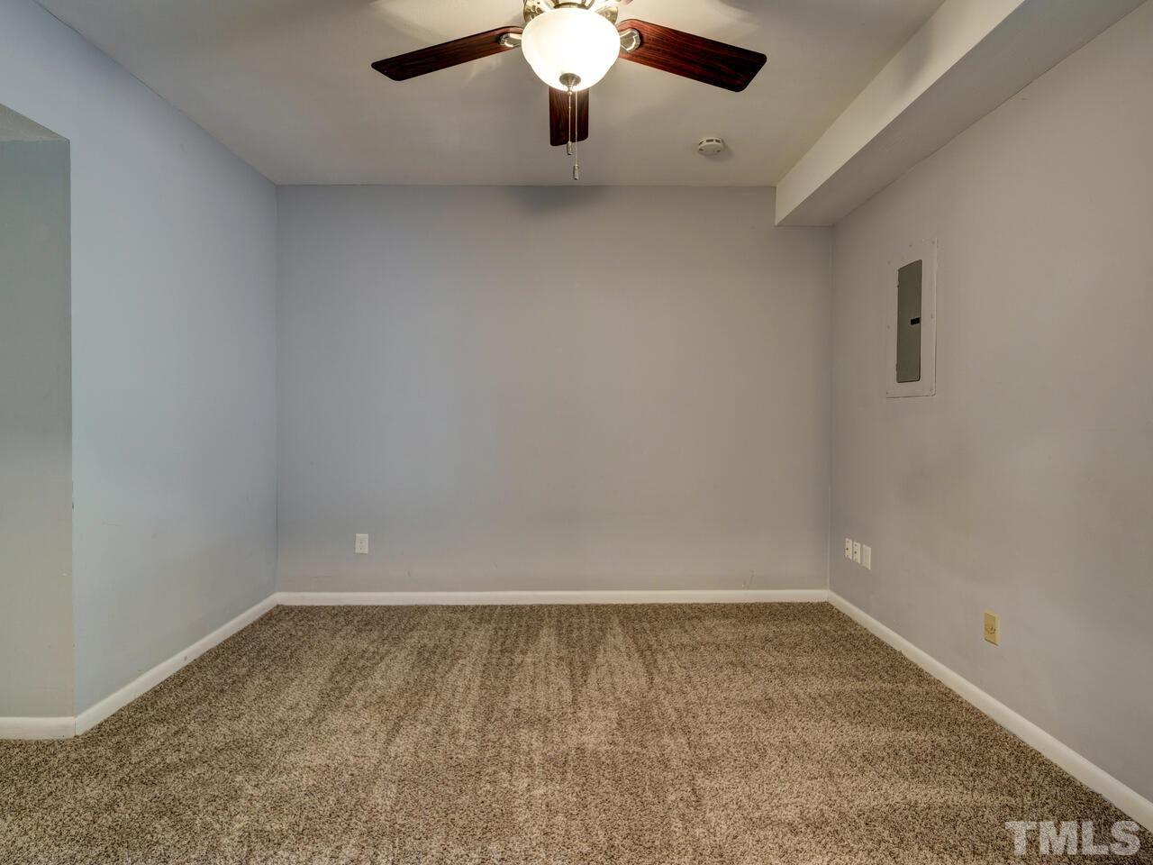 5857 Branchwood Road Raleigh, NC 27609 - Photo 28 of 42 a view of an empty room with a window