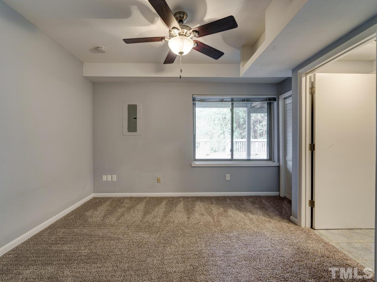 5857 Branchwood Road Raleigh, NC 27609 - Photo 31 of 42 a view of an empty room with a window