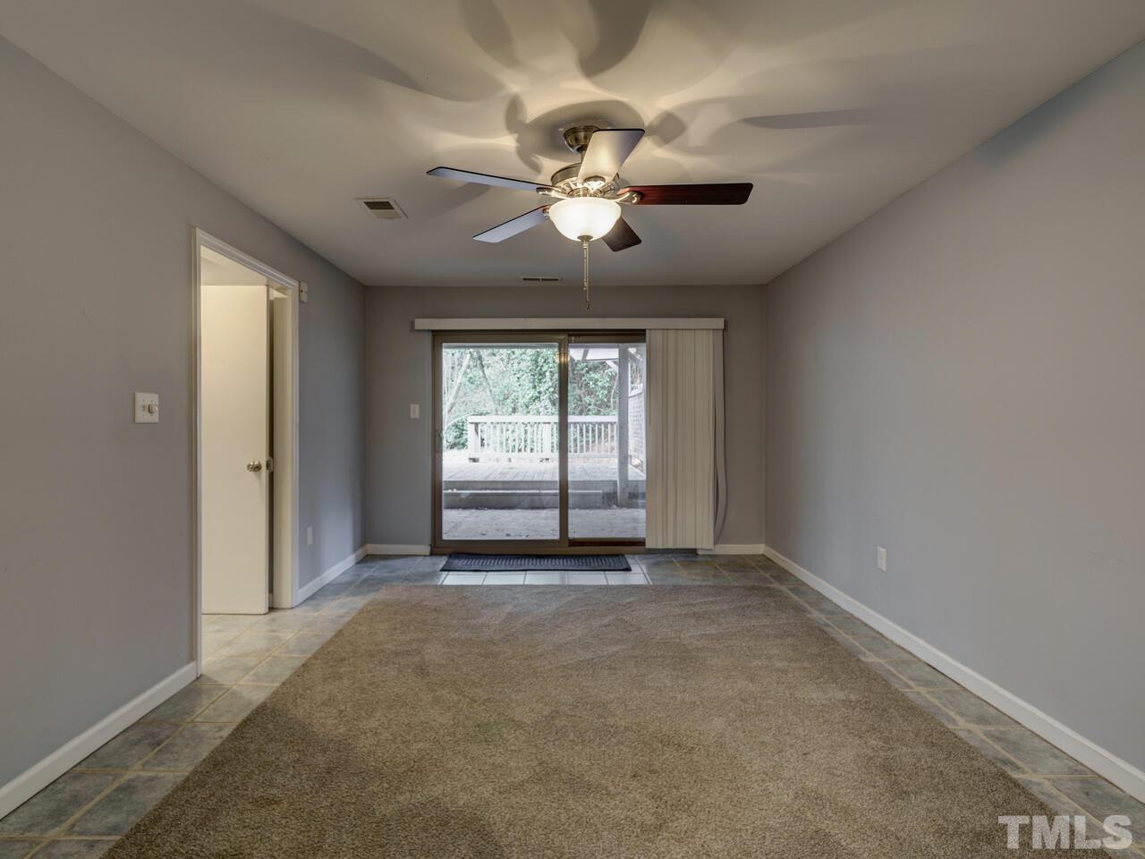 5857 Branchwood Road Raleigh, NC 27609 - Photo 33 of 42 an empty room with windows and fan
