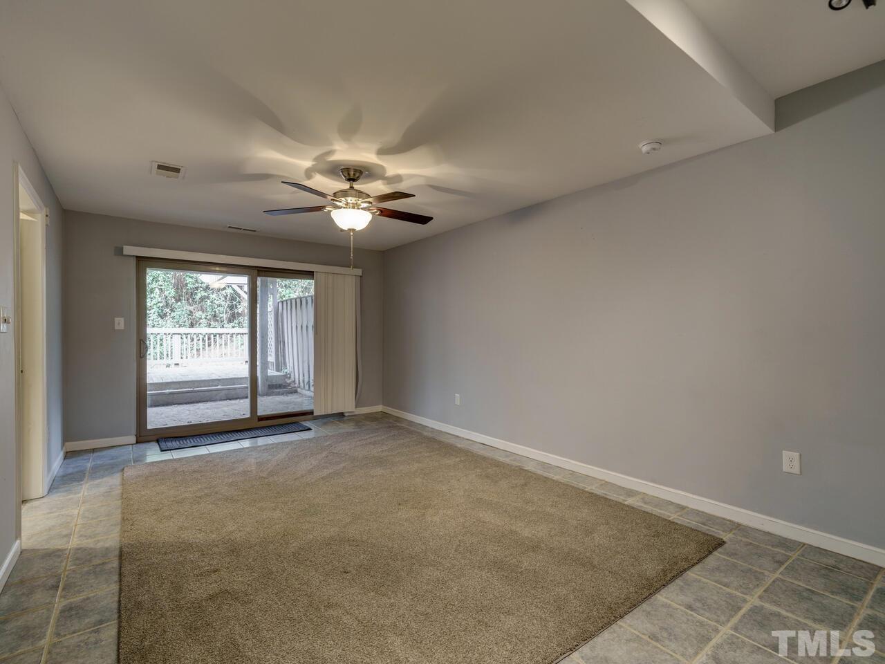 5857 Branchwood Road Raleigh, NC 27609 - Photo 34 of 42 an empty room with windows and fan