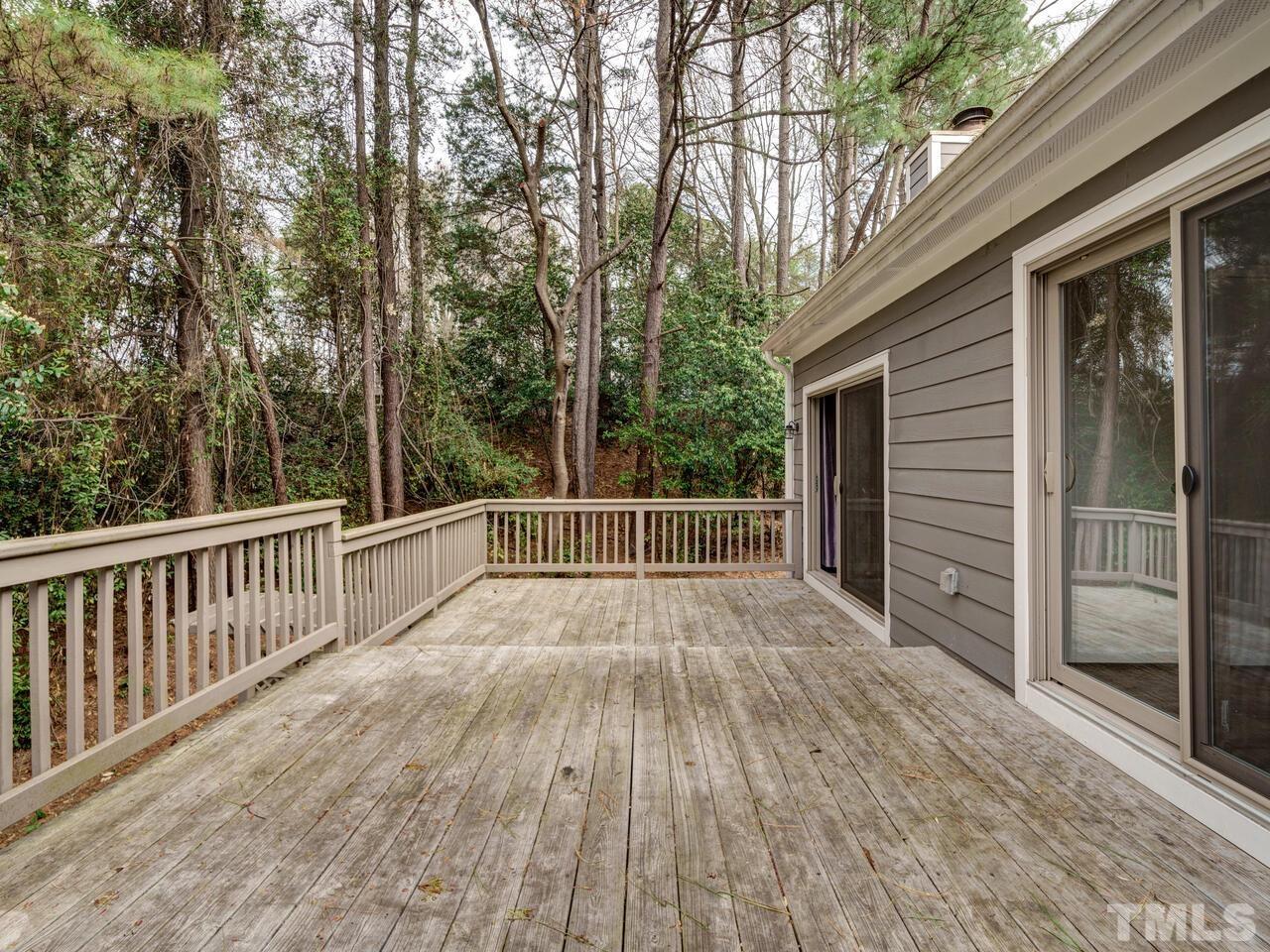 5857 Branchwood Road Raleigh, NC 27609 - Photo 40 of 42 a view of deck with wooden floor and fence