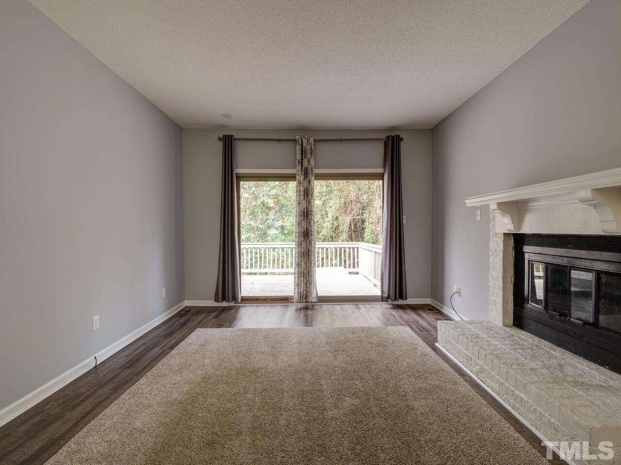 5857 Branchwood Road Raleigh, NC 27609 - Photo 10 of 42 a view of an empty room with a window
