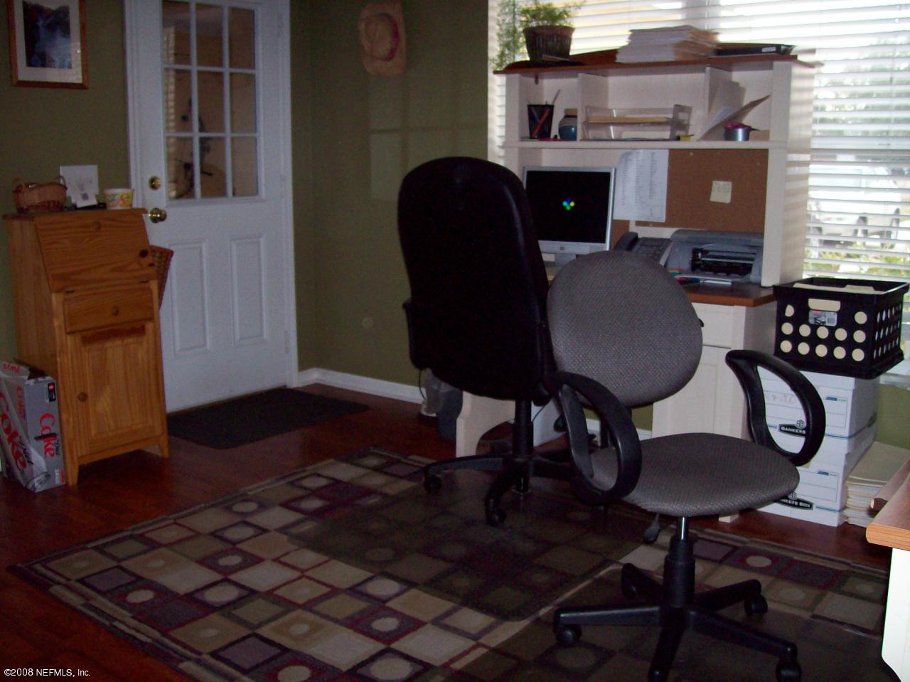44238 Quail Ridge Avenue East Callahan, FL 32011 - Photo 3 of 9 a view of a dining room with furniture and wooden floor