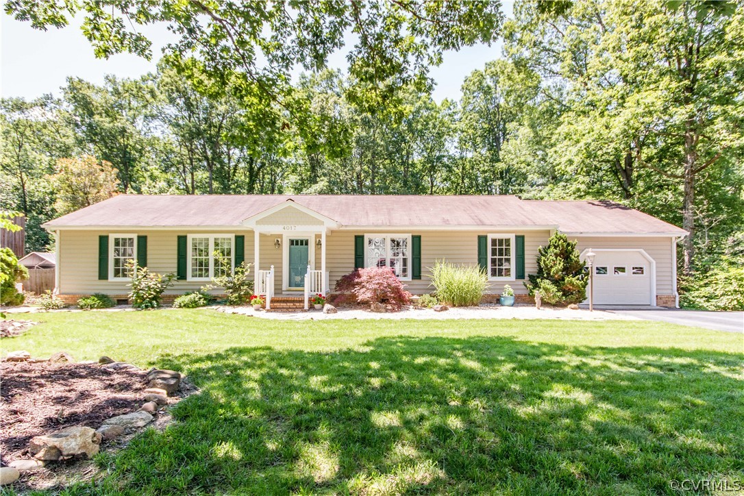 4017 Hidden Valley Road Chester, VA 23831 - Photo 1 of 50 a front view of a house with a garden and porch