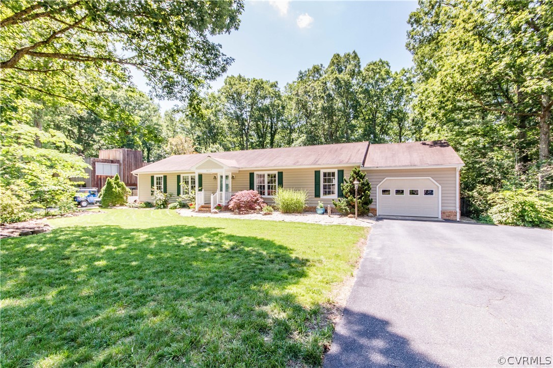 4017 Hidden Valley Road Chester, VA 23831 - Photo 2 of 50 a front view of a house with yard and garden