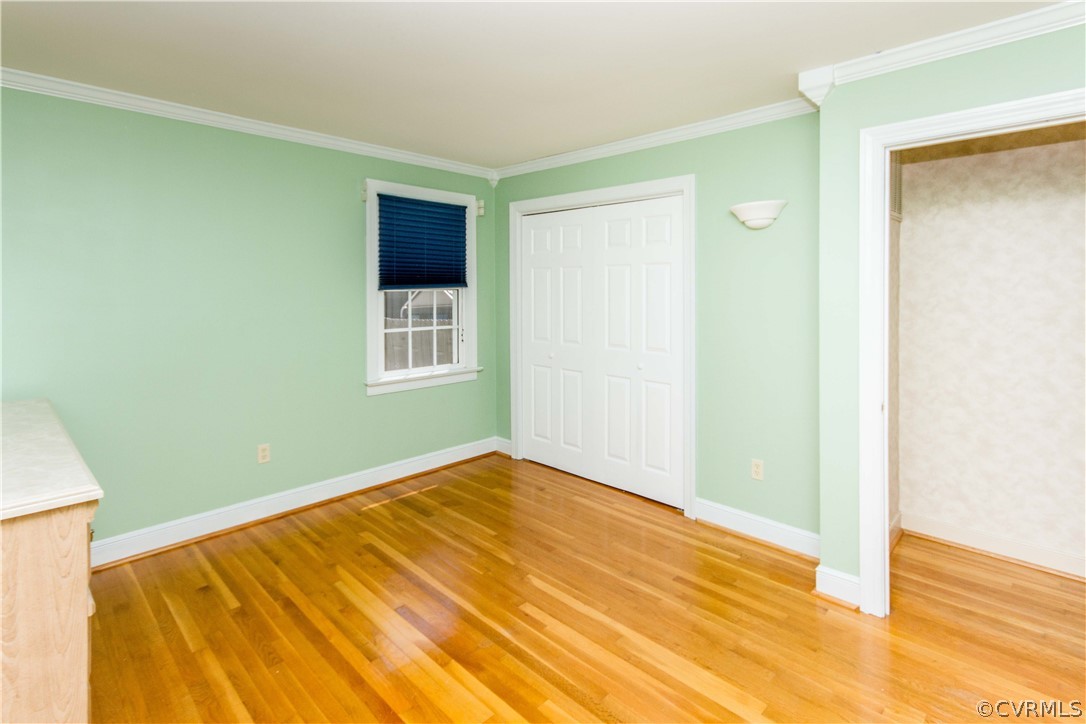 4017 Hidden Valley Road Chester, VA 23831 - Photo 36 of 50 a view of an empty room with wooden floor and a window