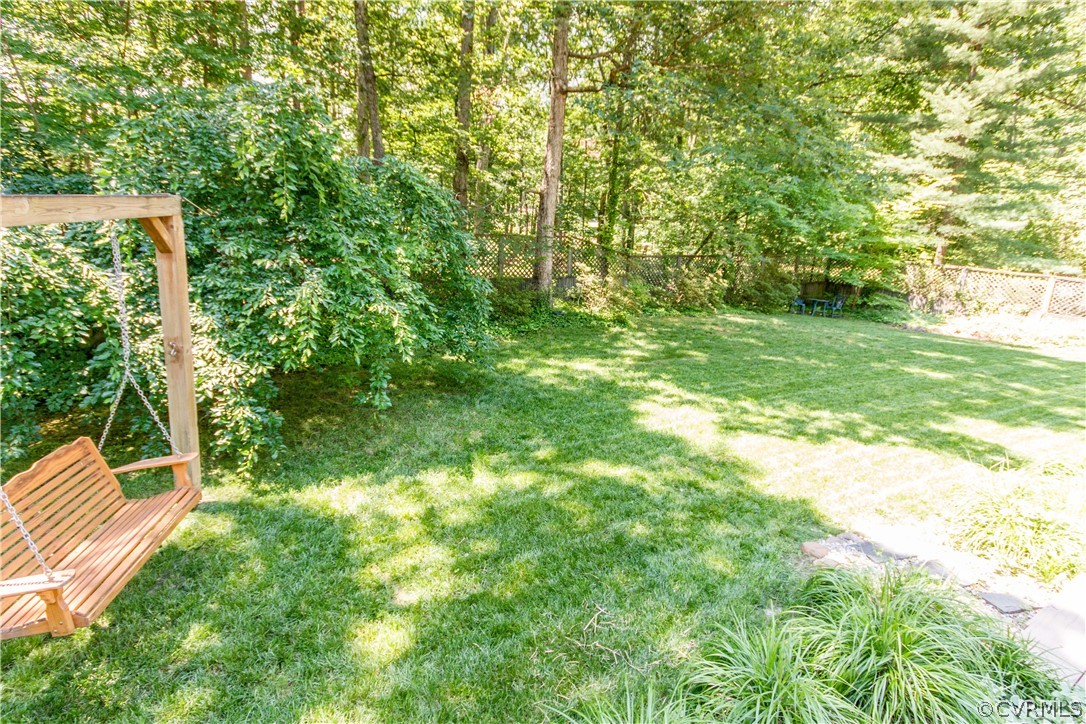 4017 Hidden Valley Road Chester, VA 23831 - Photo 47 of 50 a backyard of a house with lots of green space and fountain