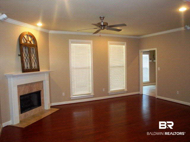 9345 Collier Loop Daphne, AL 36526 - Photo 2 of 14 UNWIND AFTER A LONG DAY AT WORK IN FRONT OF THE FIREPLACE. LIVING AREA OPENS TO DINING ROOM. GREAT SET UP FOR ENTERTAINING.