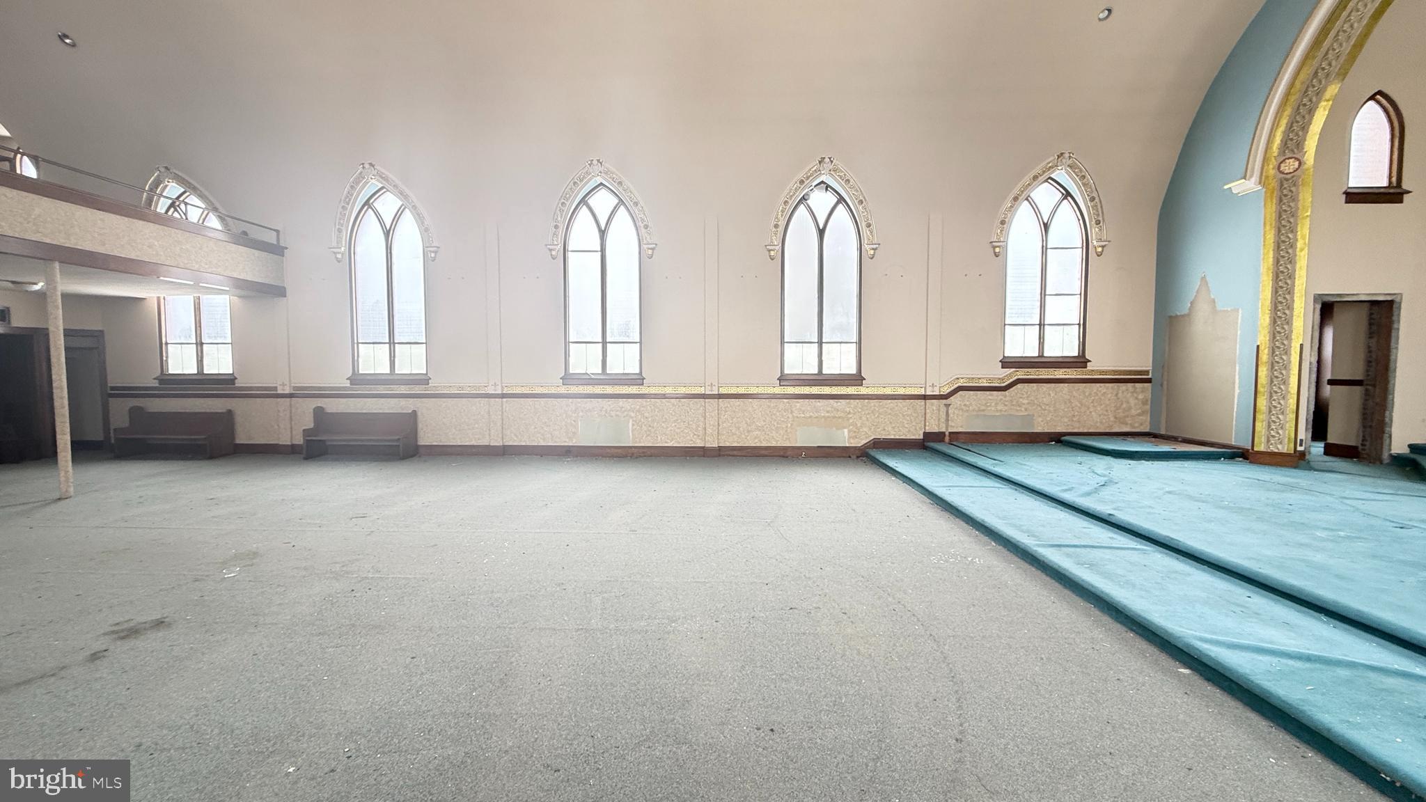 300 Vandermark Road Nanticoke, PA 18634 - Photo 10 of 22 a view of an empty room with a fireplace and windows