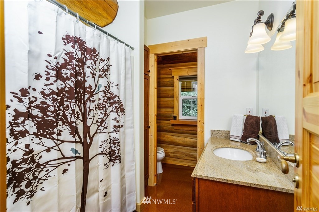 1947 Beverly Beach Road Freeland, WA 98249 - Photo 22 of 25 a bathroom with a sink and a mirror