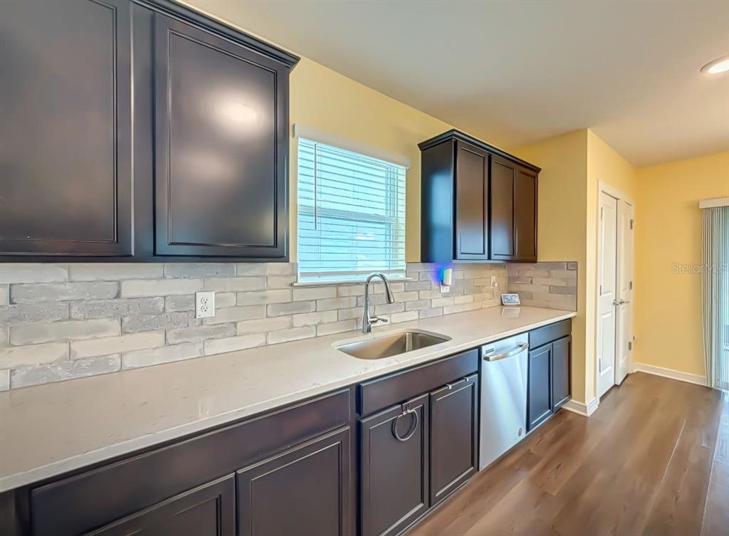 9324 Rally Spring Loop Wesley Chapel, FL 33545 - Photo 21 of 57 a bathroom with a sink and a mirror