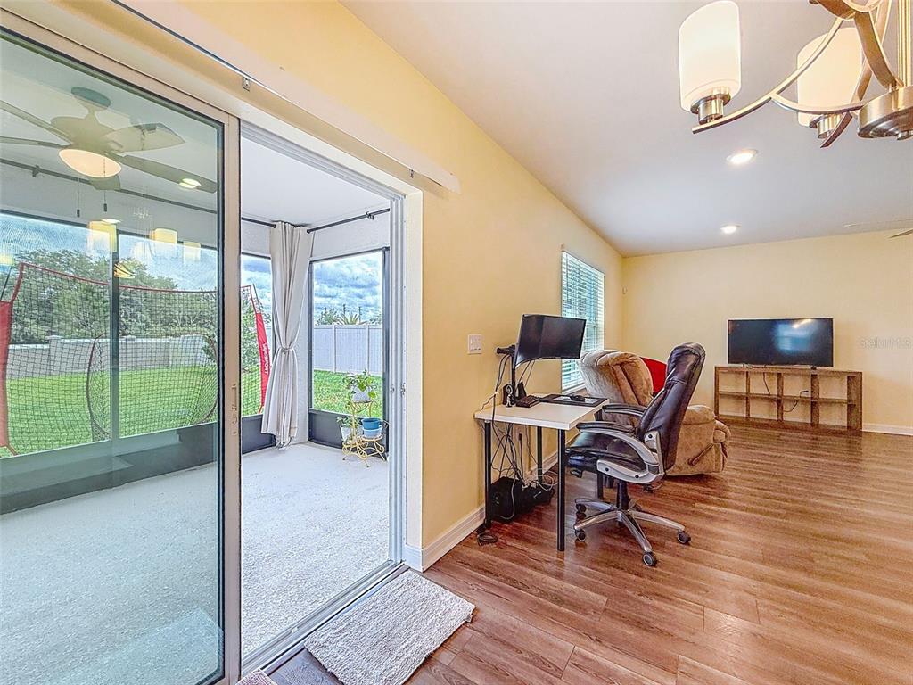 9324 Rally Spring Loop Wesley Chapel, FL 33545 - Photo 23 of 57 a view of a livingroom with furniture and a window
