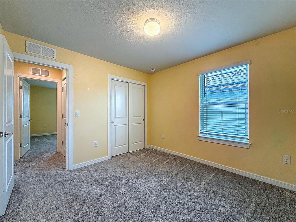 9324 Rally Spring Loop Wesley Chapel, FL 33545 - Photo 37 of 57 an empty room with windows and closet