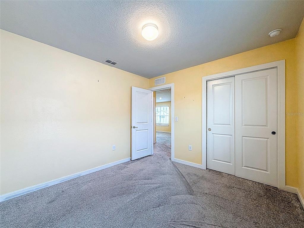 9324 Rally Spring Loop Wesley Chapel, FL 33545 - Photo 40 of 57 an empty room with closet area