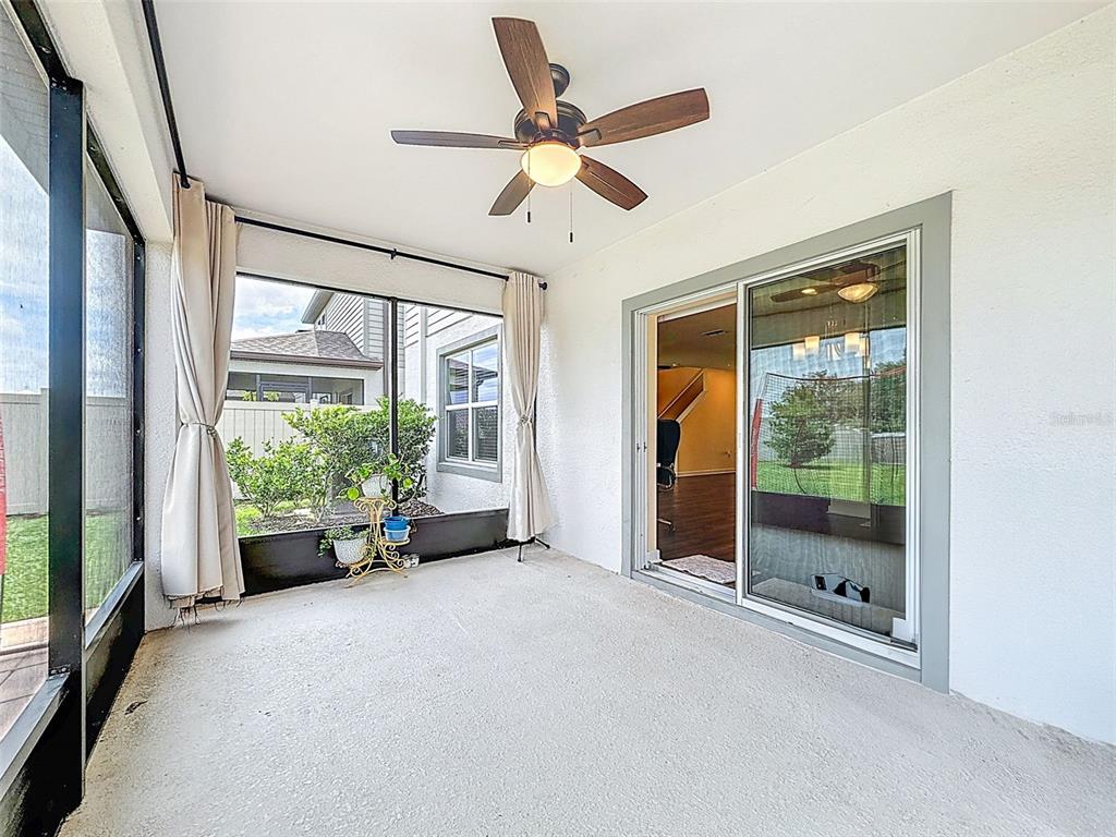 9324 Rally Spring Loop Wesley Chapel, FL 33545 - Photo 43 of 57 a living room with furniture and a large window