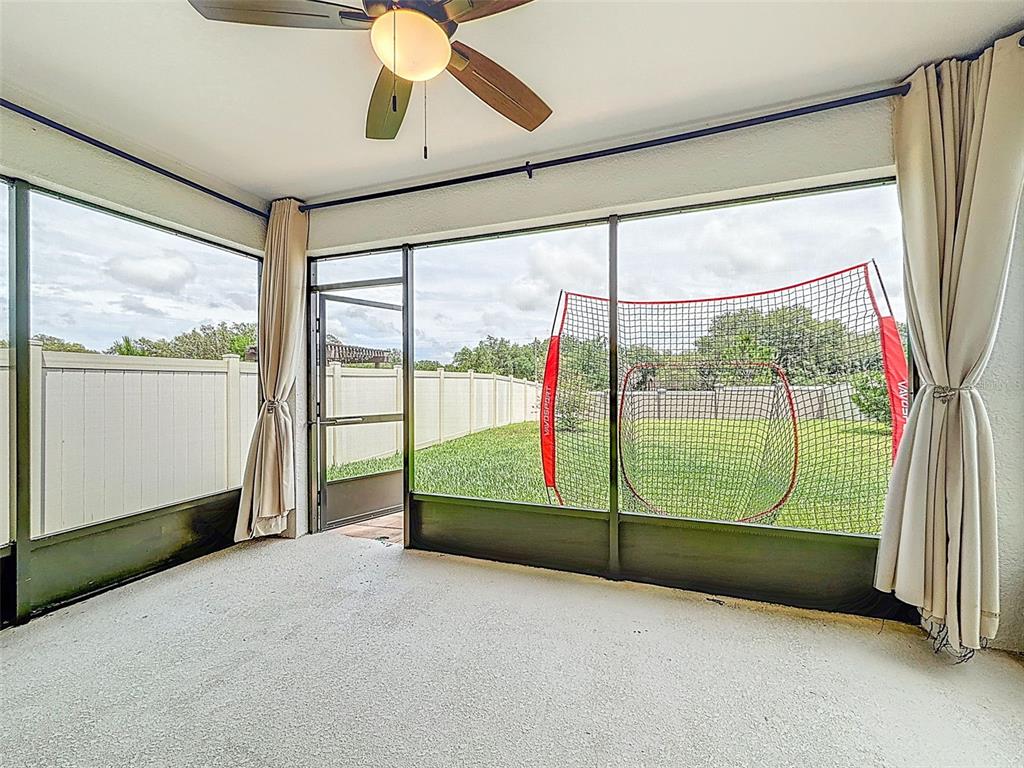 9324 Rally Spring Loop Wesley Chapel, FL 33545 - Photo 44 of 57 a view of an empty room with windows