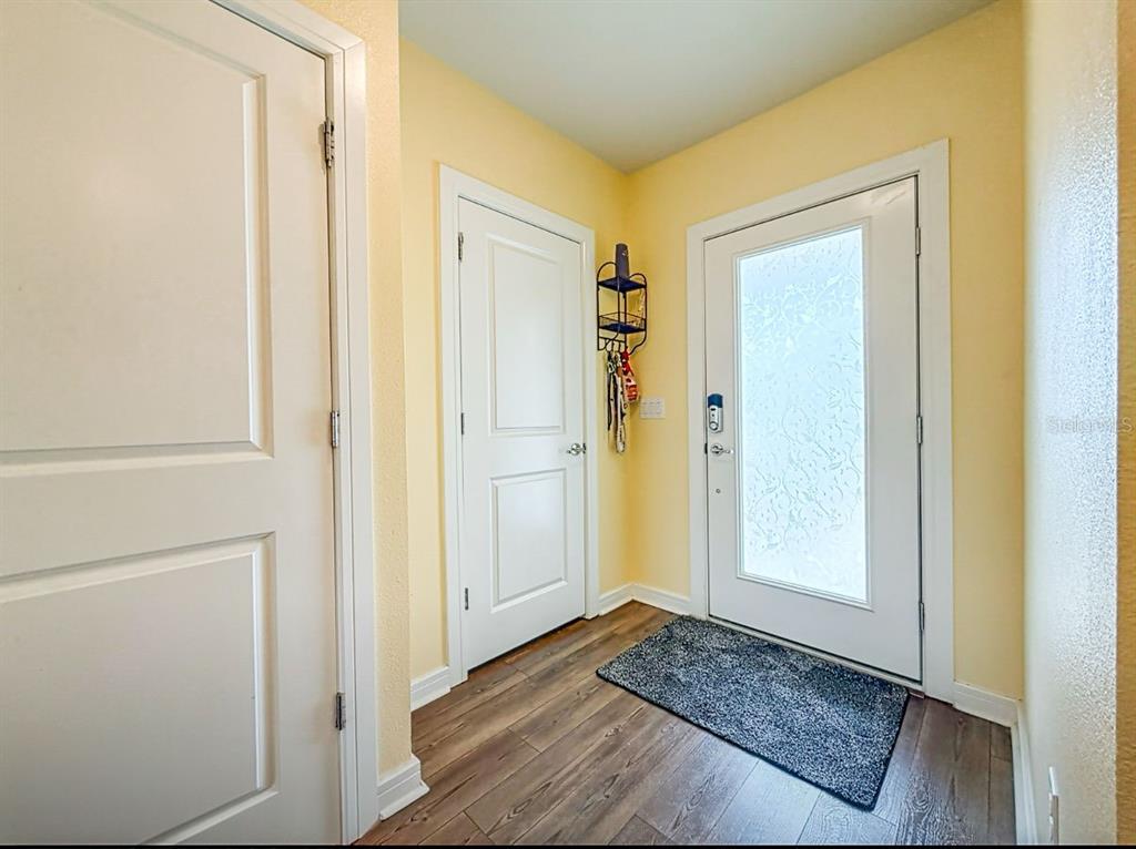 9324 Rally Spring Loop Wesley Chapel, FL 33545 - Photo 8 of 57 a view of front door