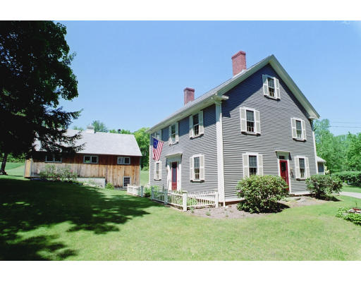 409 Pepperell Road Groton, MA 01450 - Photo 1 of 28 a front view of a house with a yard