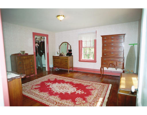 409 Pepperell Road Groton, MA 01450 - Photo 17 of 28 a living room with furniture and a rug