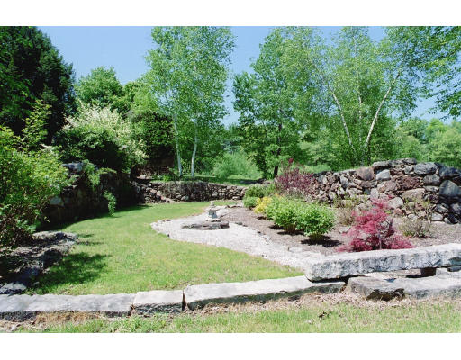 409 Pepperell Road Groton, MA 01450 - Photo 6 of 28 a view of backyard with plants and outdoor seating