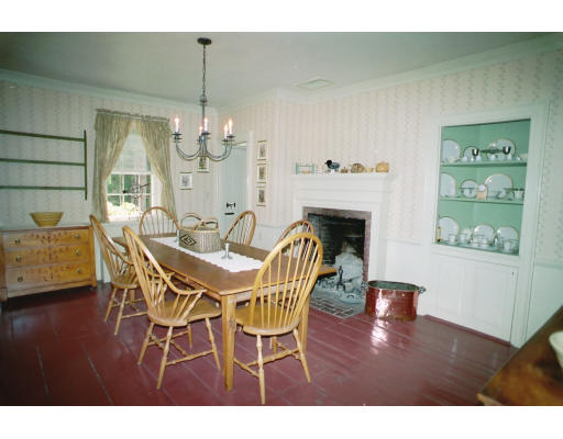 409 Pepperell Road Groton, MA 01450 - Photo 9 of 28 a view of a dining room with furniture wooden floor and chandelier