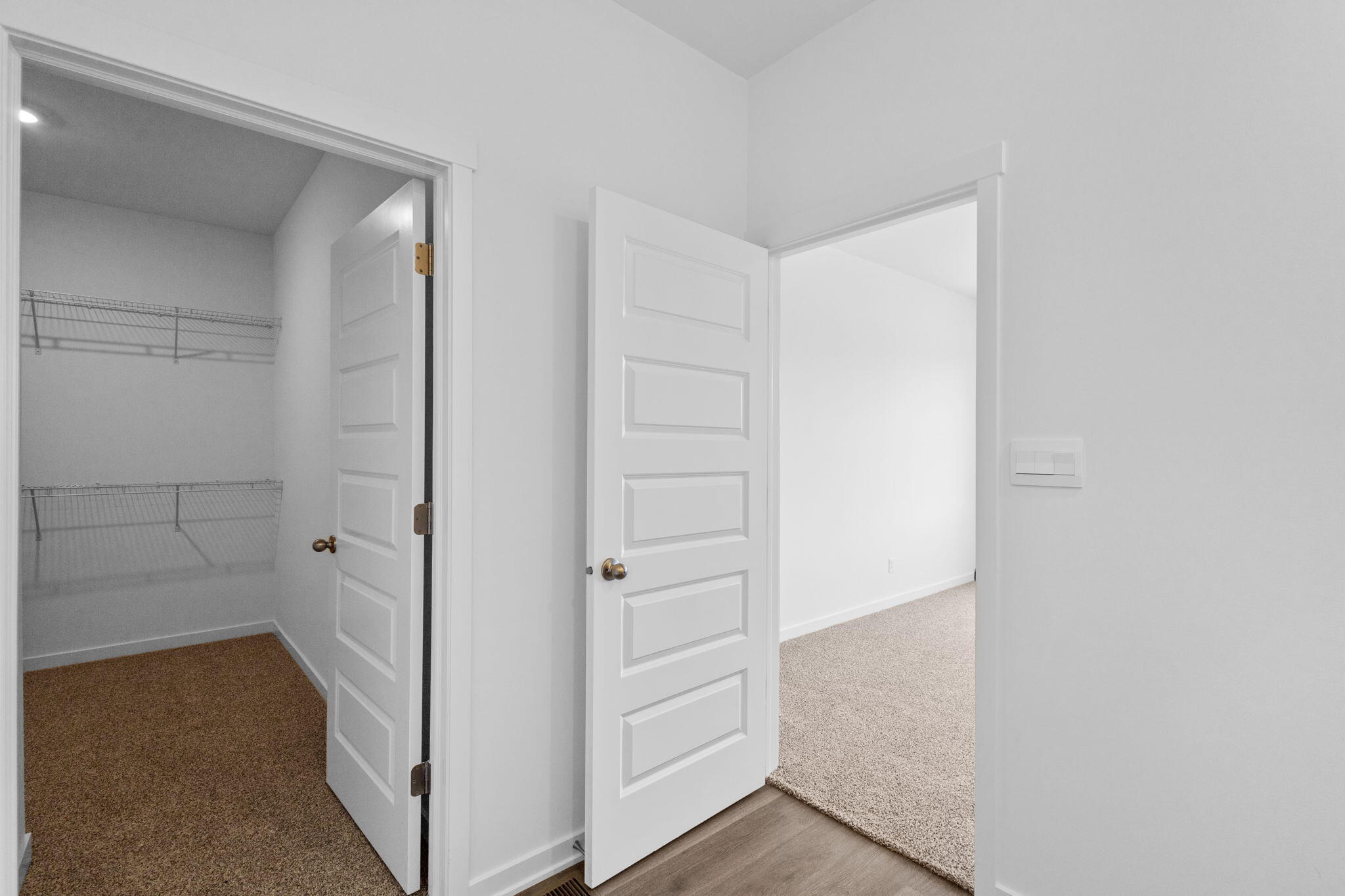 10568 Morse Place Crown Point, IN 46307 - Photo 7 of 16 a view of walk in closet with empty racks