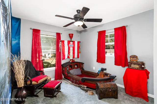 a living room with furniture and a window