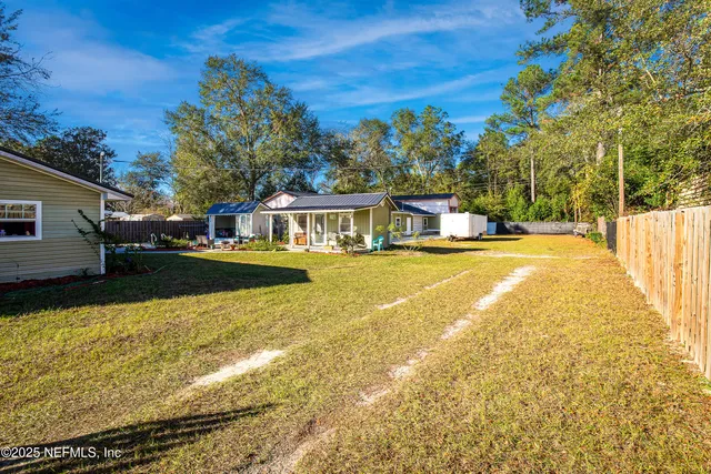 a view of a swimming pool with an outdoor seating