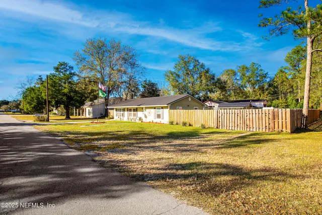 a view of a swimming pool with an outdoor space and seating area