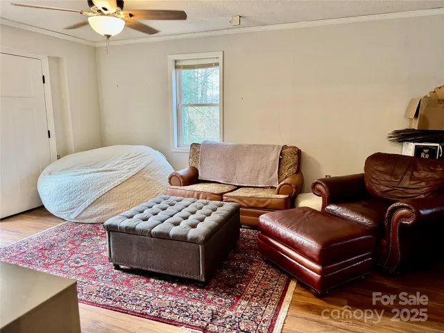 a bedroom with furniture and a window