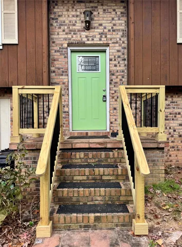 a front view of a house with many windows