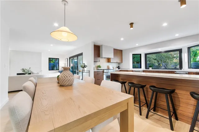 a kitchen with stainless steel appliances a stove top oven sink and cabinets