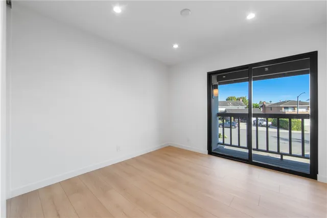 a lobby with furniture and potted plants