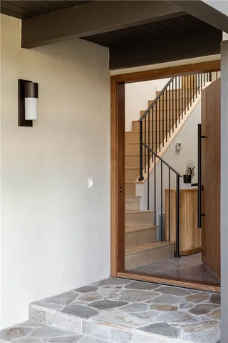 wooden floor view with staircase and door