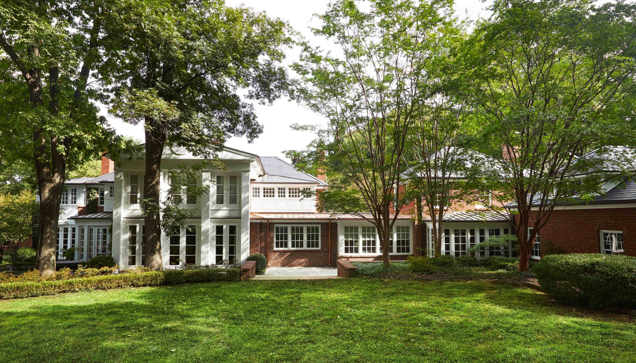 907 Overton Lea Road Nashville, TN 37220 - Photo 21 of 24 a front view of a house with a garden