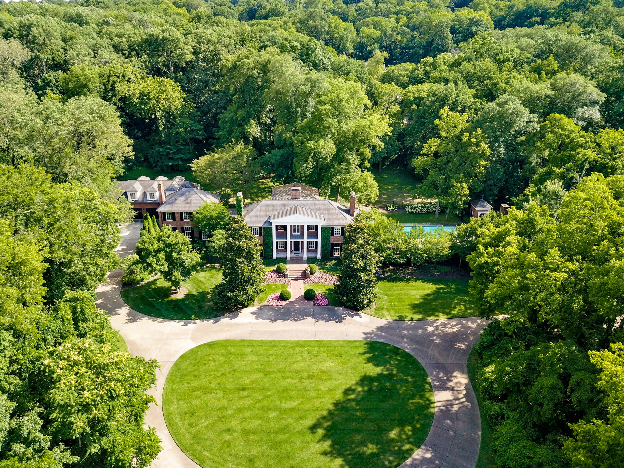 907 Overton Lea Road Nashville, TN 37220 - Photo 22 of 24 a view of a garden with a slide