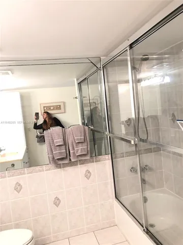 a view of a swimming pool with a table and chairs