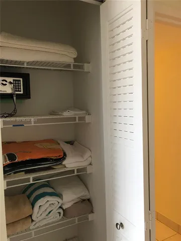 a view of a livingroom with furniture and a chandelier