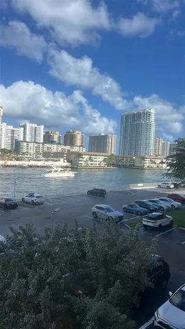 a view of a patio with table and chairs under an umbrella