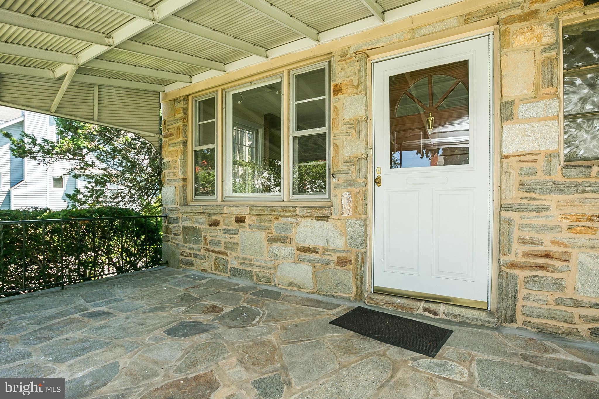 3301 Marnat Road Baltimore, MD 21208 - Photo 2 of 27 a front view of a house with a garden